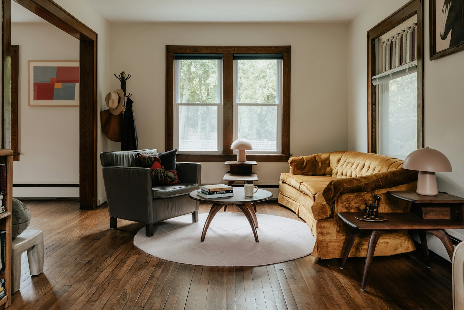 Living room with hardwood, a rug and furniture—the surfaces a robot must navigate